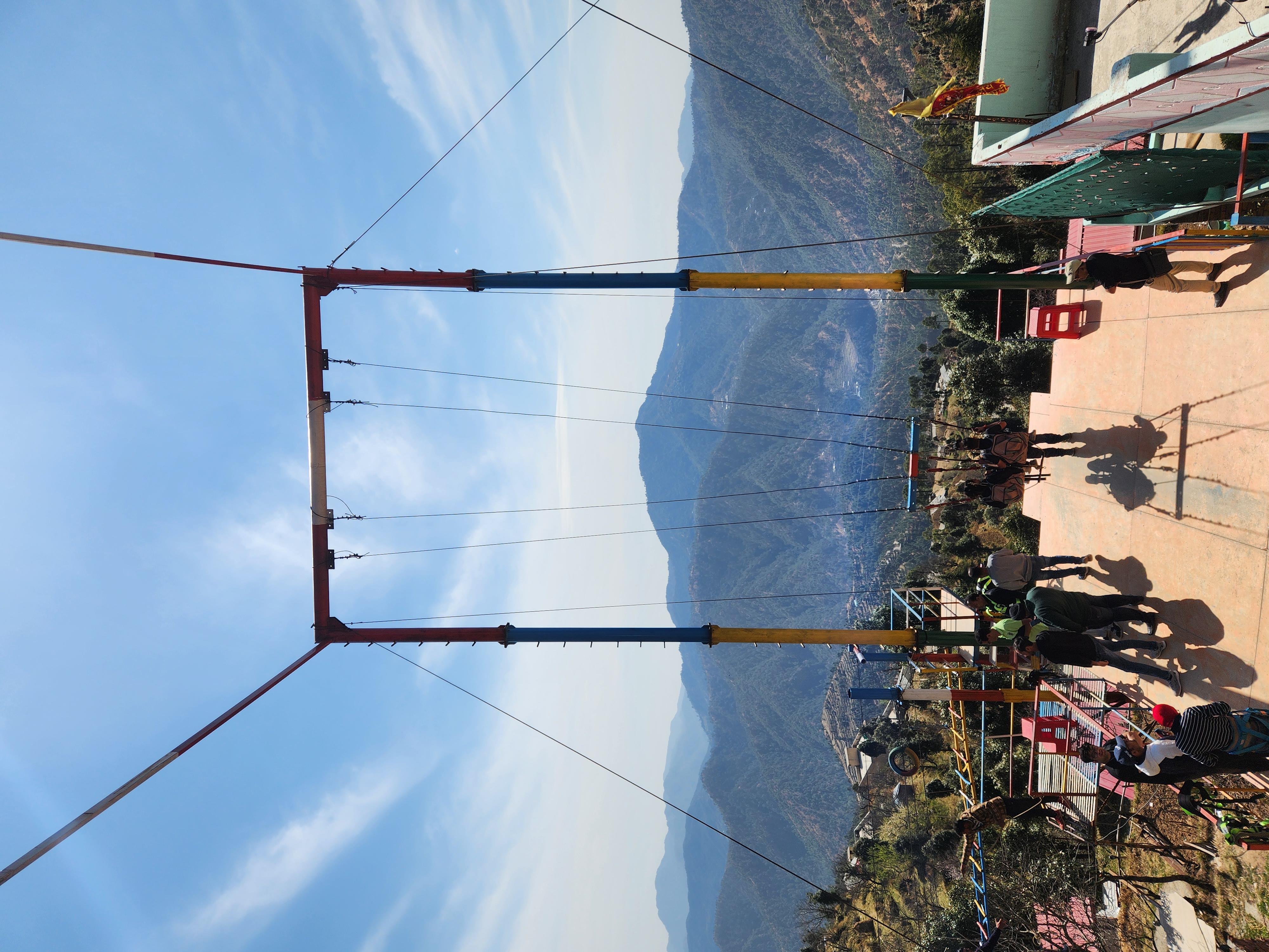 Mountain adventure swing overlooking the hills near Kanatal
